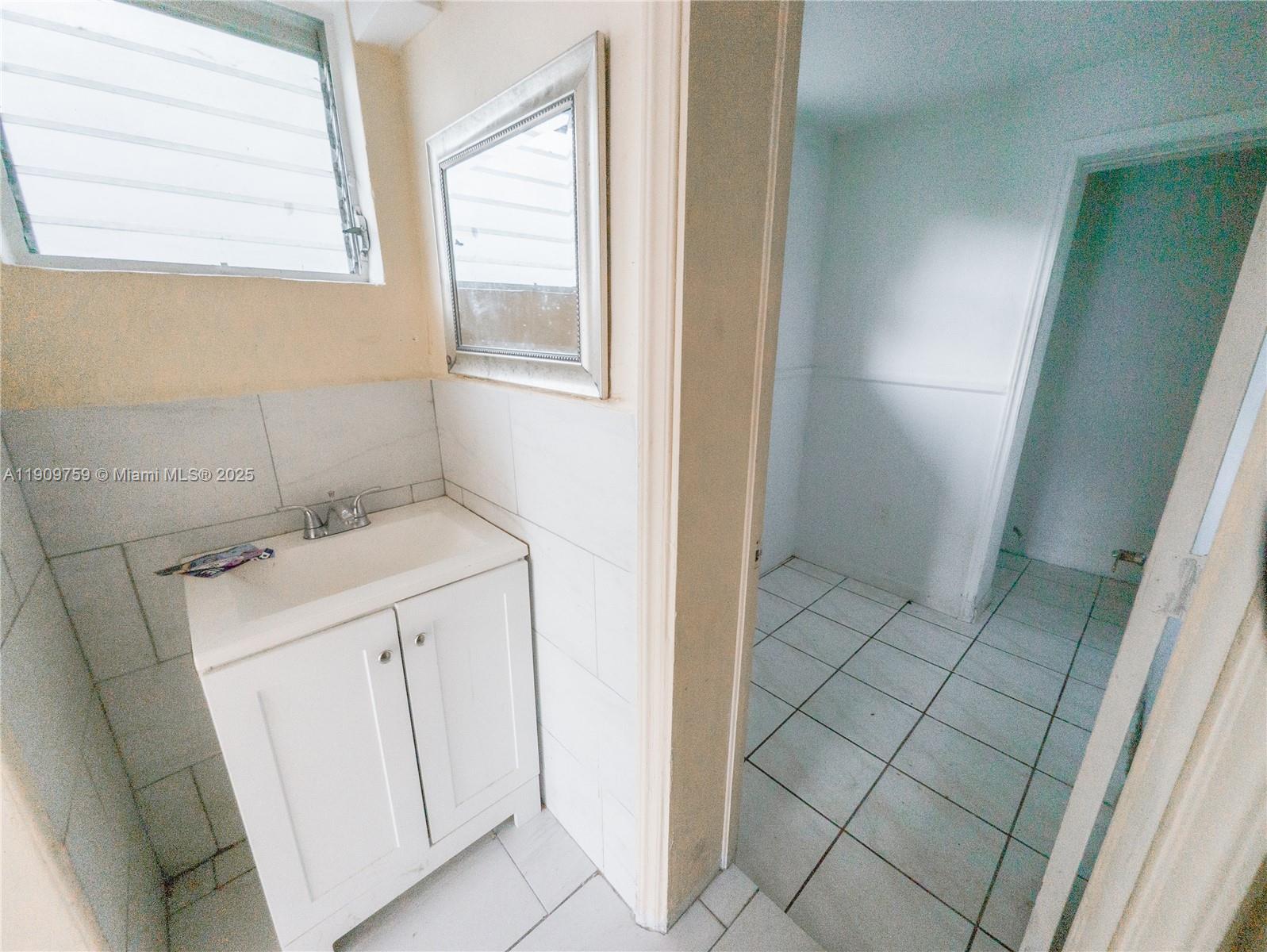 2575 Southwest 59th Avenue, Unit 2575 Miami, FL 33155 - Photo 15 of 21 a utility room with dryer and washer