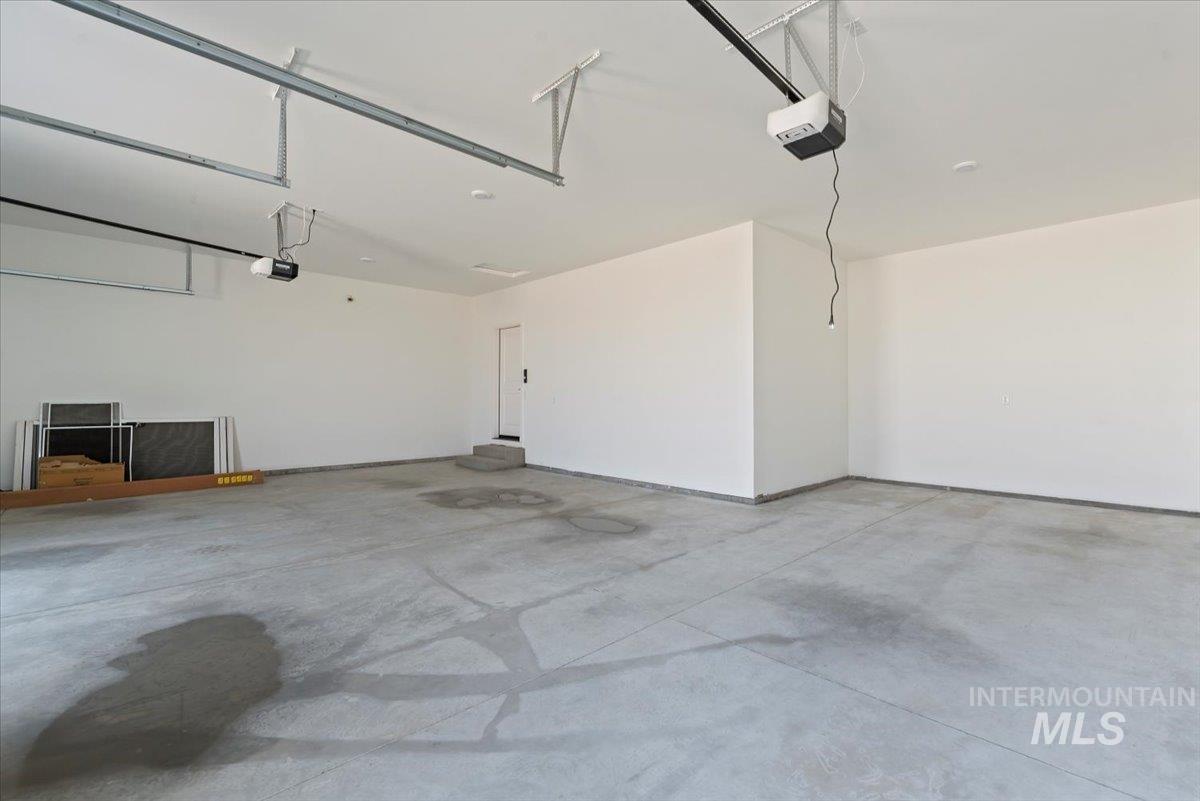 1300 Birch Street Parma, ID 83660 - Photo 16 of 25 Garage featuring a garage door opener