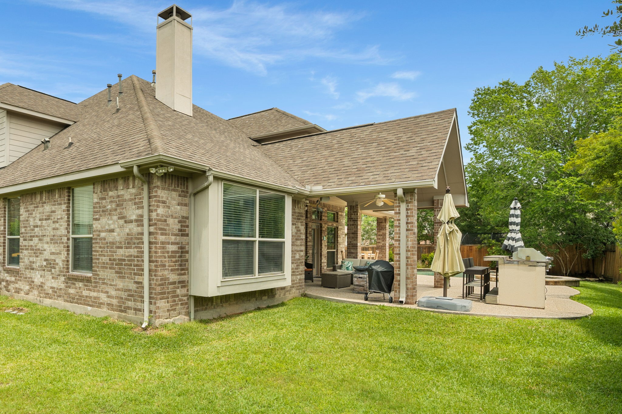 11 Pintuck Place Spring, TX 77389 - Photo 35 of 40 a view of a house with a backyard and a garden