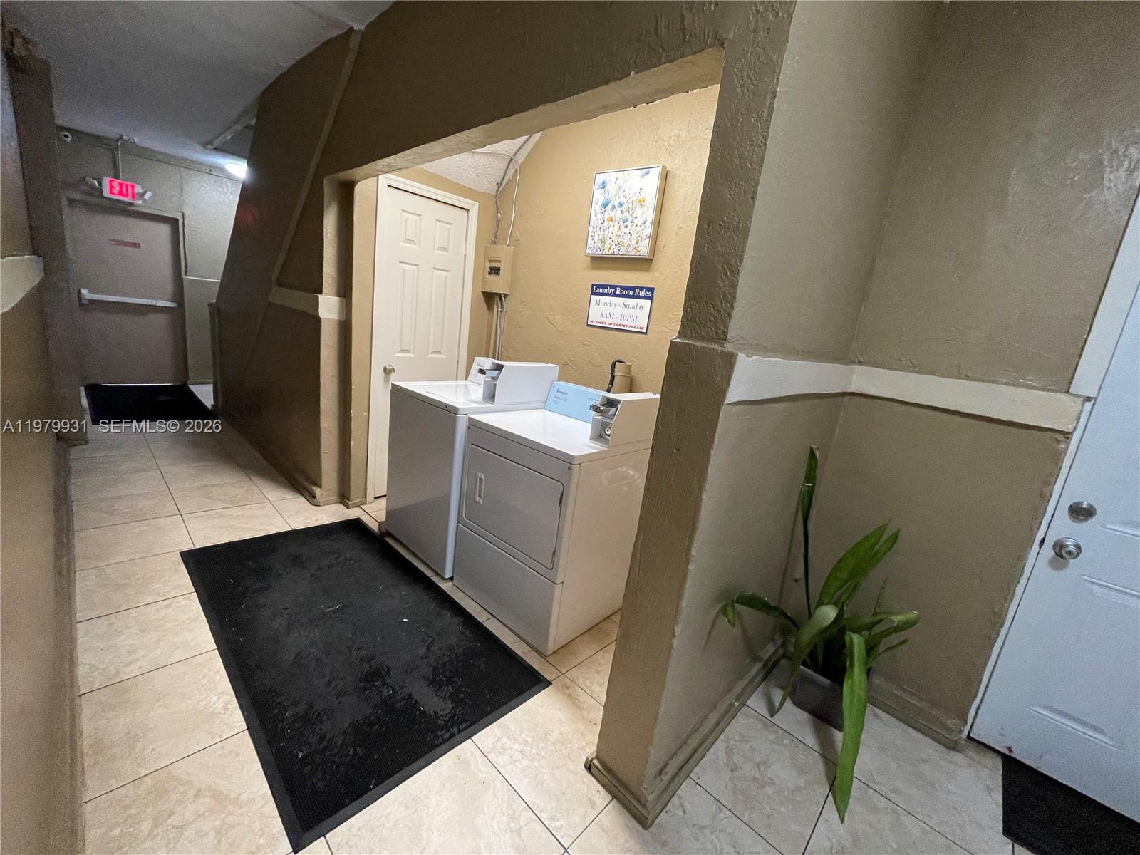 1060 Northwest 47th Street, Unit 5 Miami, FL 33127 - Photo 18 of 19 a view of kitchen with furniture and a potted plant