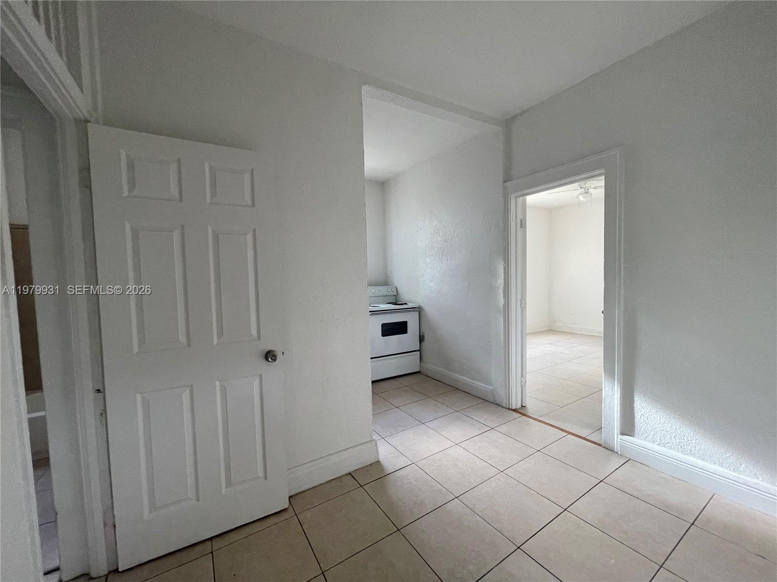 1060 Northwest 47th Street, Unit 5 Miami, FL 33127 - Photo 3 of 19 a view of a closet area in a room