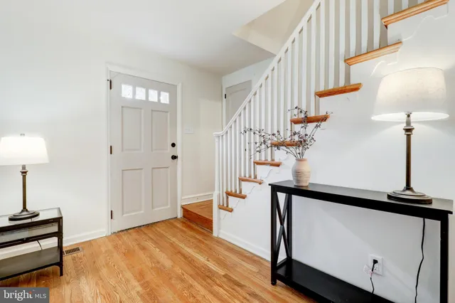 a view of an entryway with wooden floor