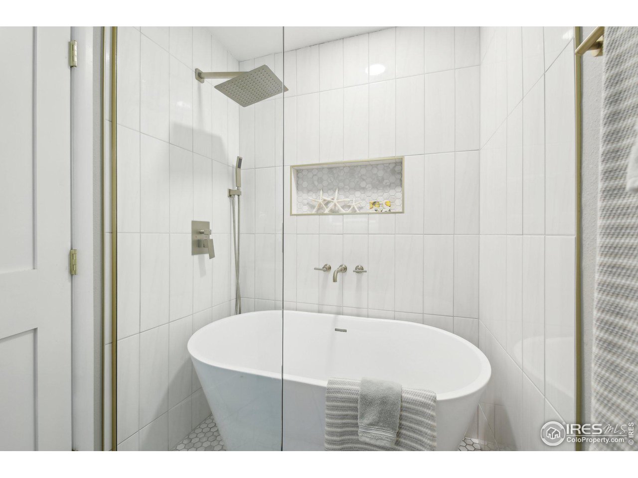 1310 Toedtli Drive Boulder, CO 80305 - Photo 13 of 40 a bathroom with a bathtub and a shower