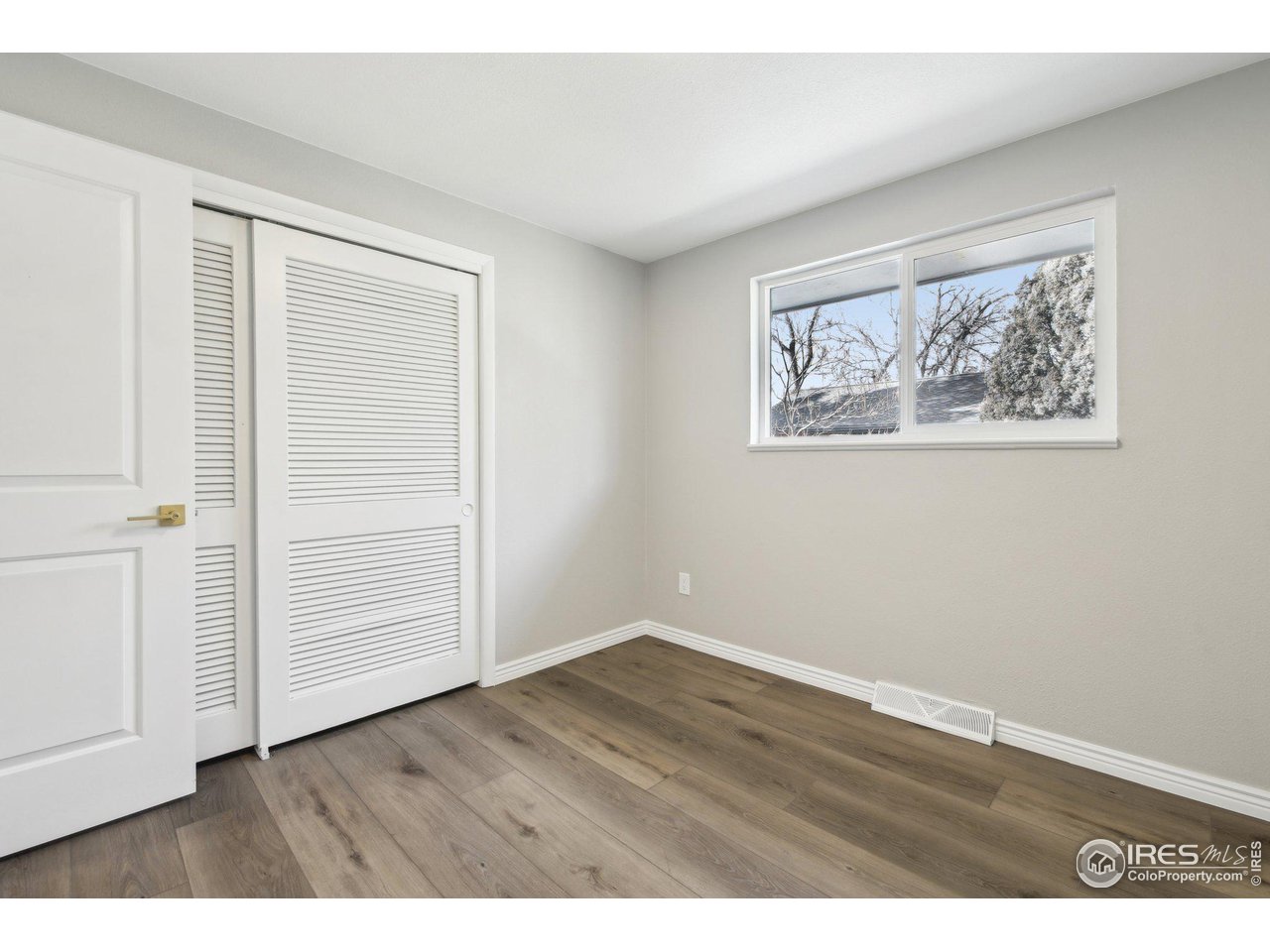 1310 Toedtli Drive Boulder, CO 80305 - Photo 14 of 40 an empty room with wooden floor and closet
