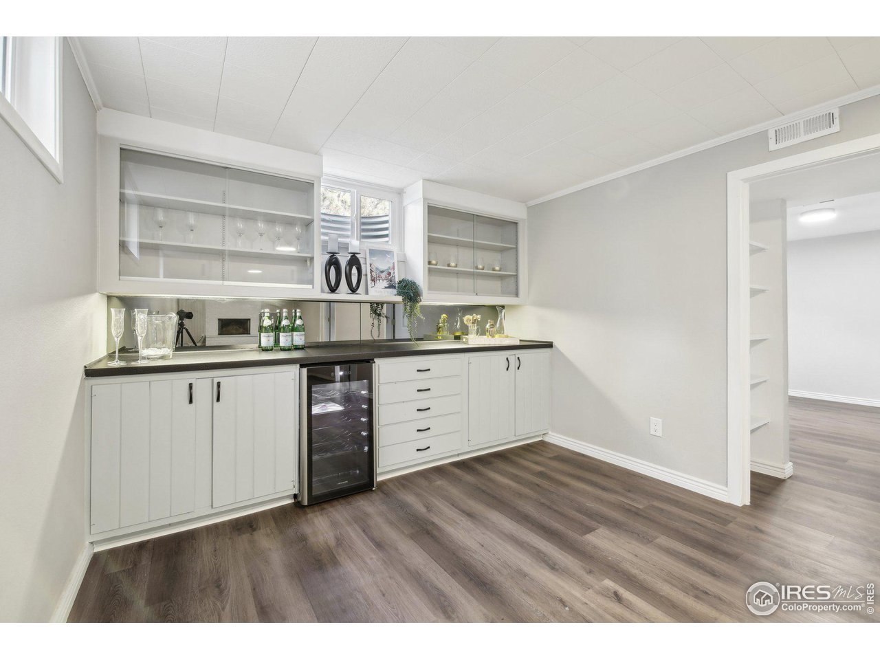 1310 Toedtli Drive Boulder, CO 80305 - Photo 21 of 40 a kitchen with a sink cabinets and wooden floor