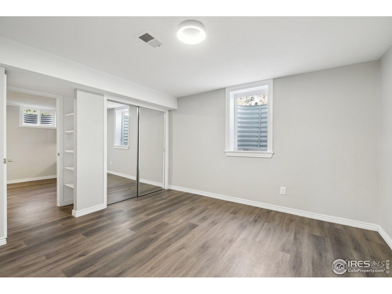 1310 Toedtli Drive Boulder, CO 80305 - Photo 26 of 40 wooden floor in an empty room with a window