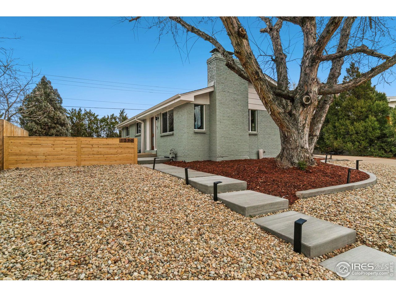 1310 Toedtli Drive Boulder, CO 80305 - Photo 31 of 40 a view of a backyard with large trees