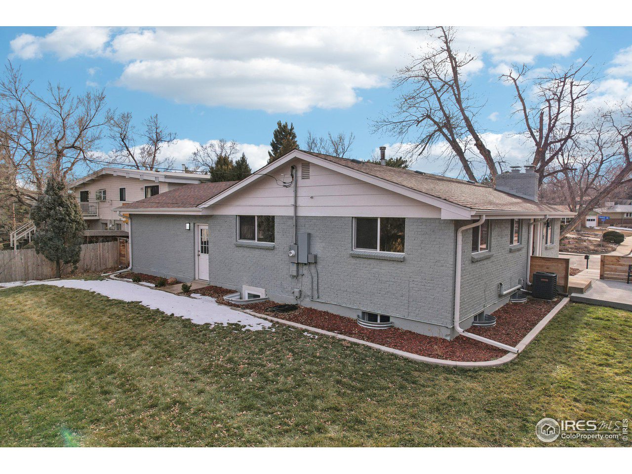 1310 Toedtli Drive Boulder, CO 80305 - Photo 35 of 40 a view of a house with a yard