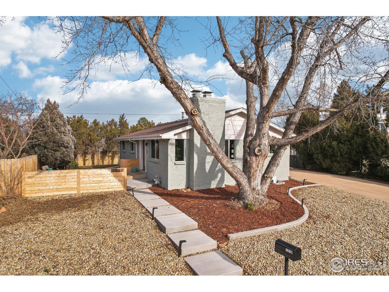 1310 Toedtli Drive Boulder, CO 80305 - Photo 37 of 40 a view of a house with trees in the background