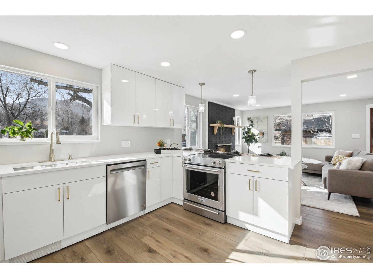 1310 Toedtli Drive Boulder, CO 80305 - Photo 6 of 40 a kitchen with granite countertop a stove top oven sink and cabinets