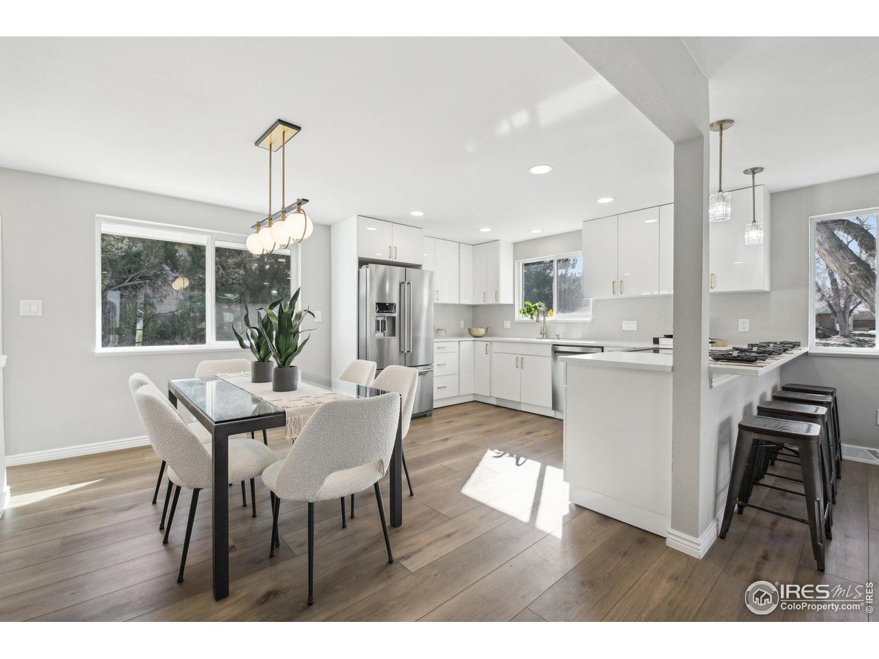 1310 Toedtli Drive Boulder, CO 80305 - Photo 8 of 40 a view of a dining room with furniture and wooden floor