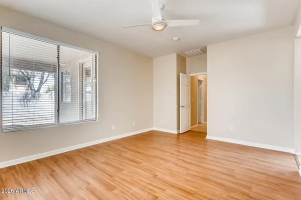 a bathroom with a sink a light fixture and a mirror