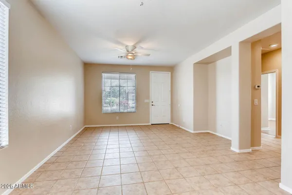 a view of an empty room with a window