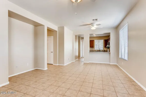 a view of a kitchen with a sink and a refrigerator a cabinets