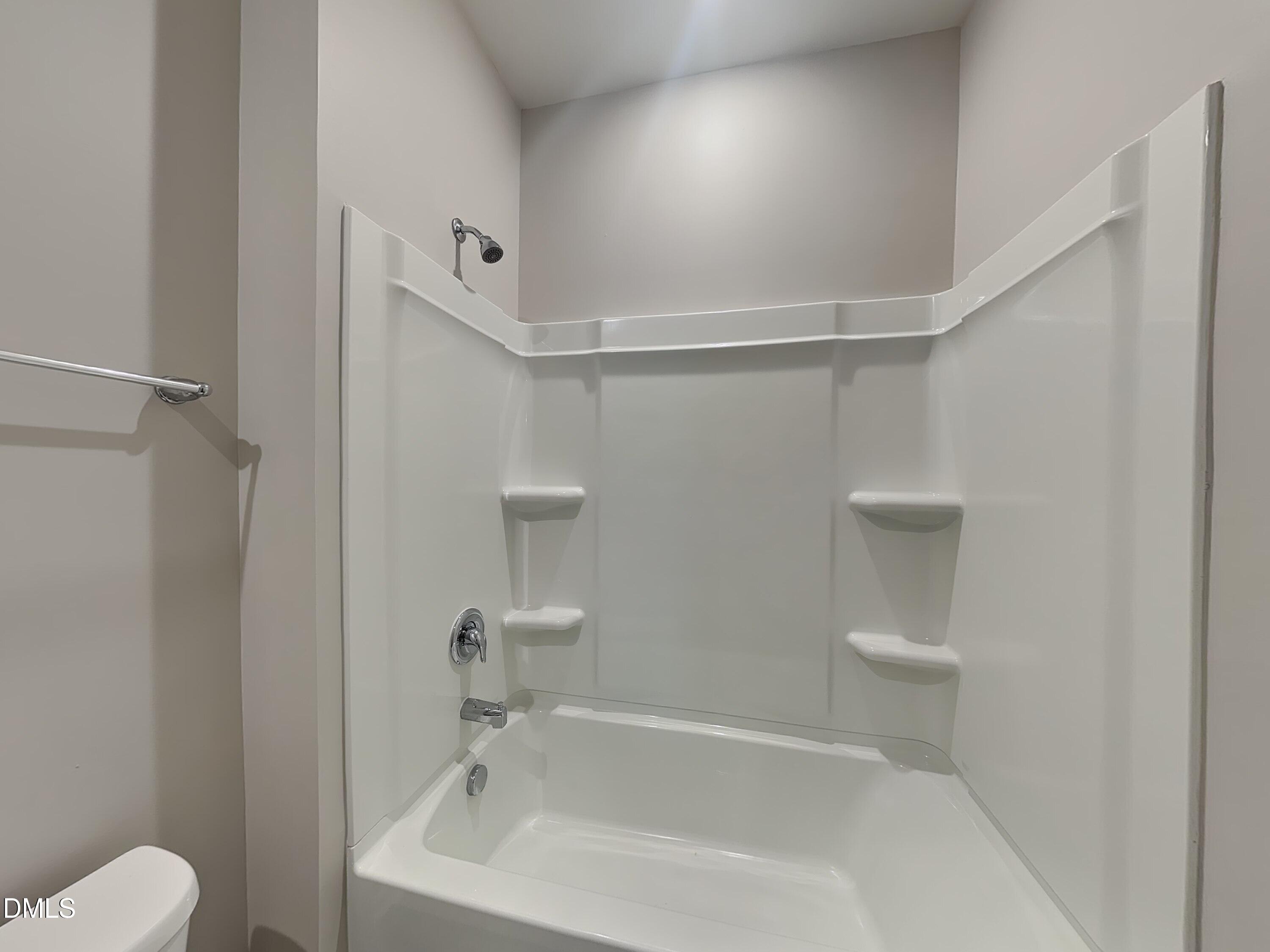 1416 Justice Union Court Raleigh, NC 27604 - Photo 12 of 16 a white bath tub sitting next to a white toilet