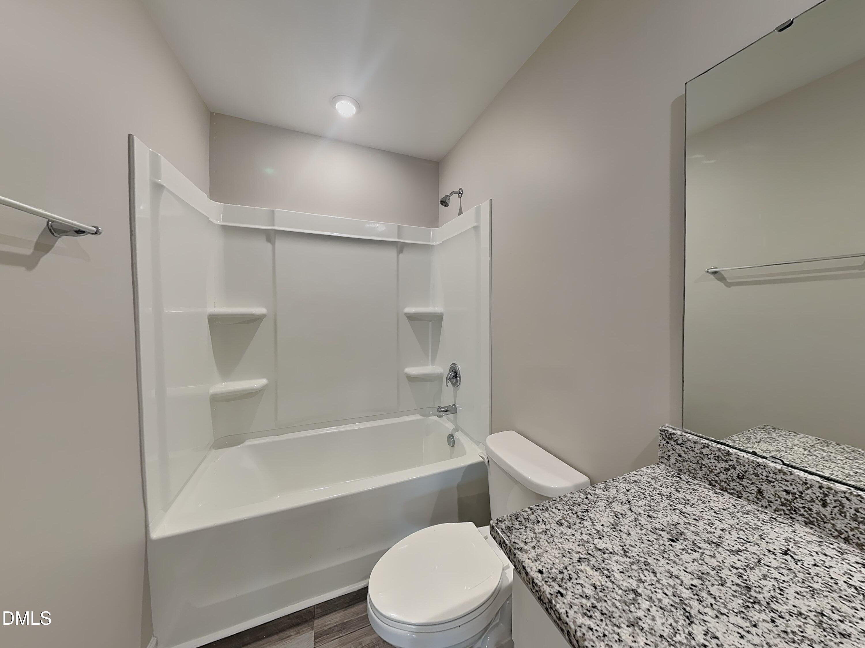 1416 Justice Union Court Raleigh, NC 27604 - Photo 13 of 16 a bathroom with a bathtub toilet and sink