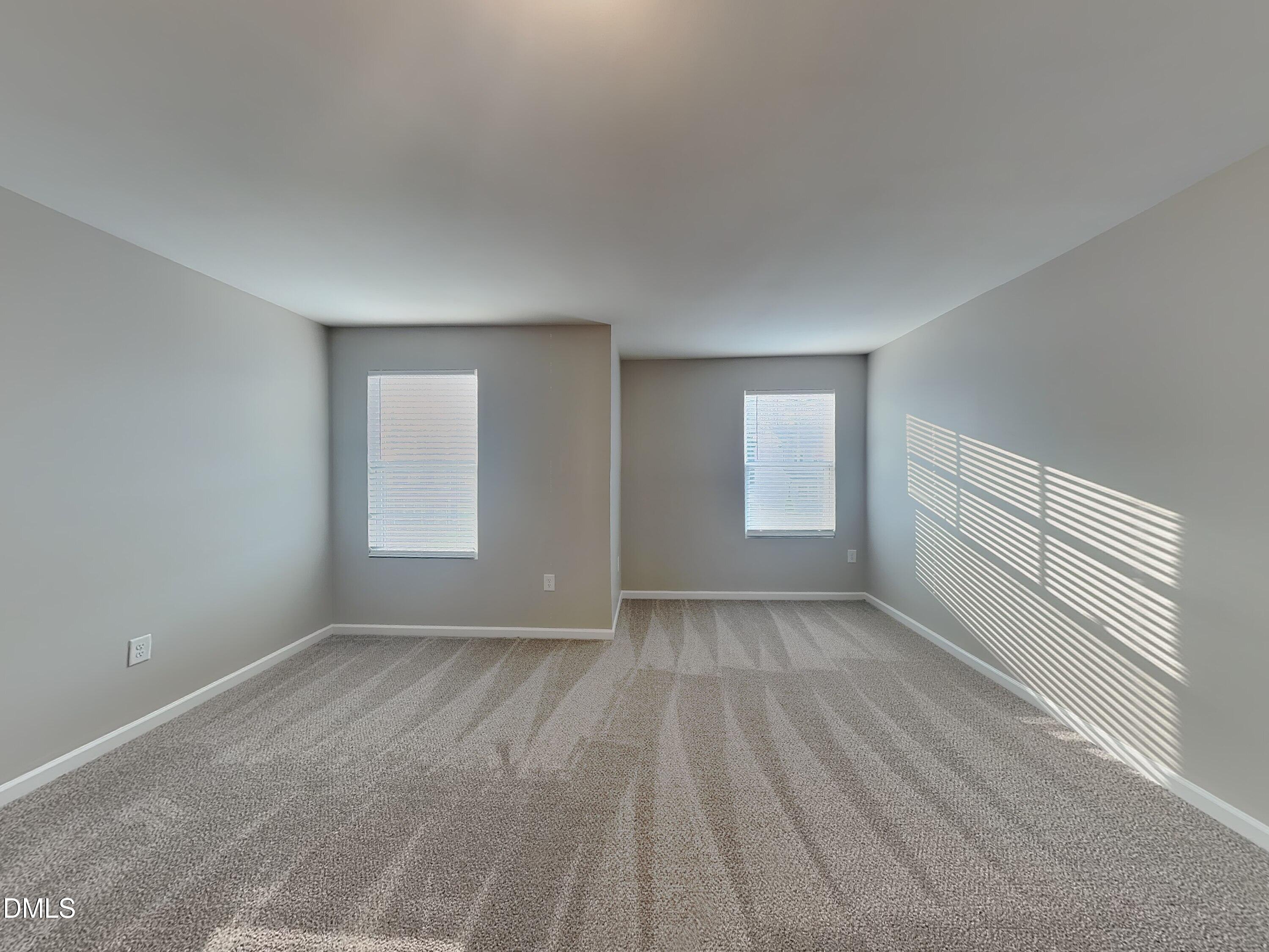 1416 Justice Union Court Raleigh, NC 27604 - Photo 15 of 16 a view of an empty room with wooden floor and window
