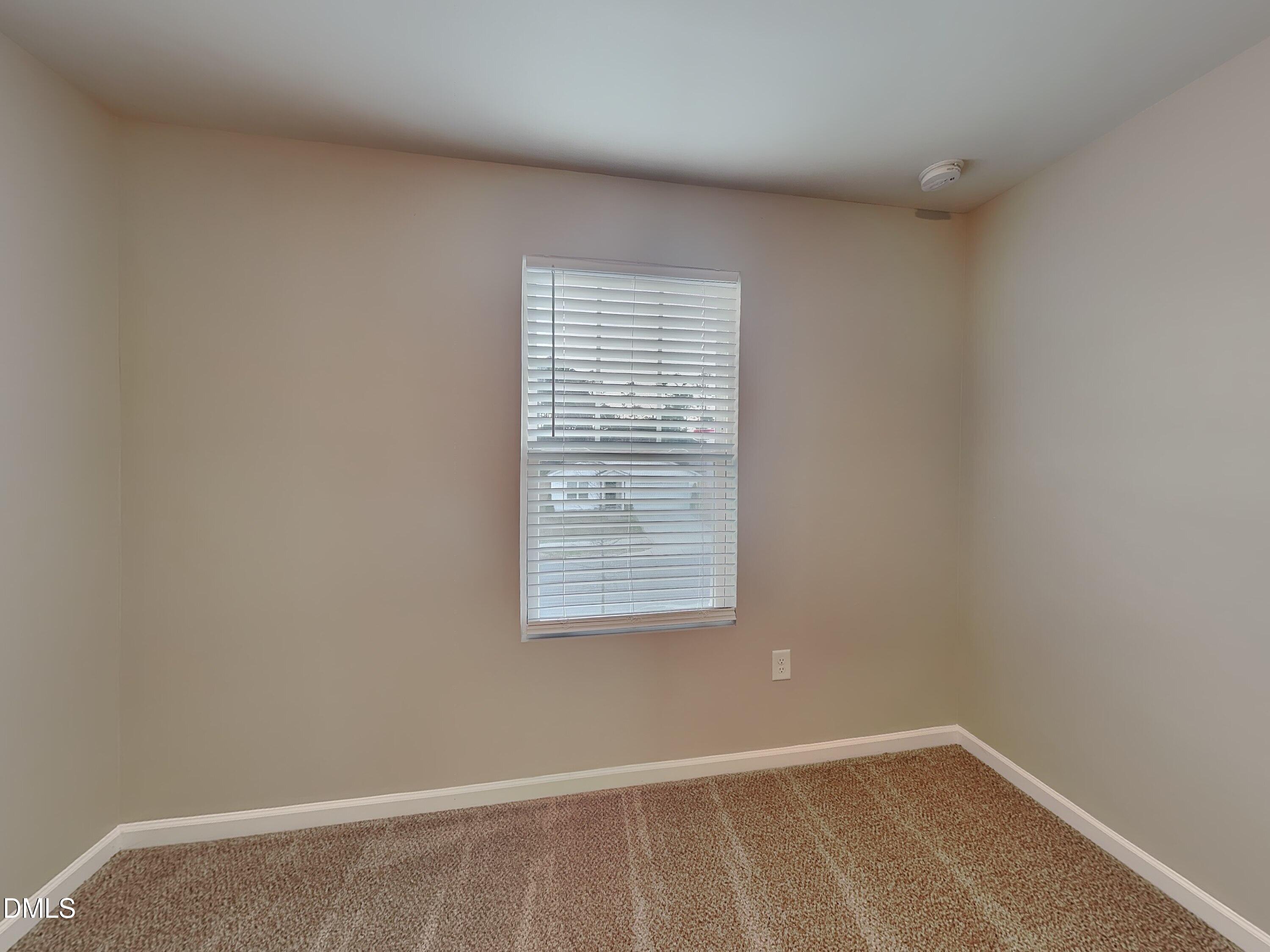 1416 Justice Union Court Raleigh, NC 27604 - Photo 10 of 16 a view of an empty room with a window