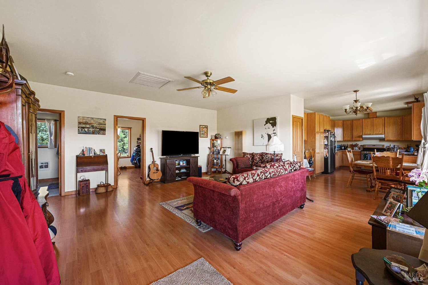 5143 Dry Creek Road Healdsburg, CA 95448 - Photo 35 of 85 a living room with furniture kitchen view and a flat screen tv