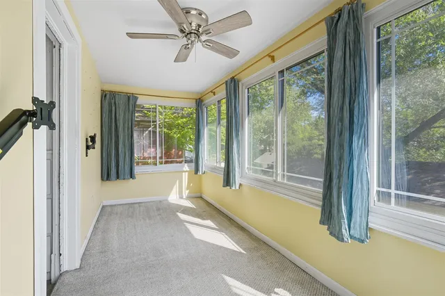 a view of a room with a large window