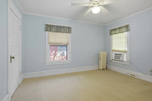 a view of an empty room with storage