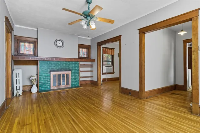 a view of livingroom with hardwood floor and a ceiling fan