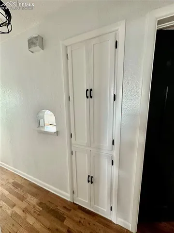 a house with trees in the background