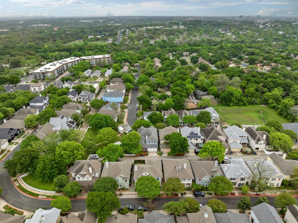 2730 Kinney Oaks Court Austin, TX 78704 - Photo 32 of 32 An aerial perspective captures the peaceful residential neighborhood surrounded by mature trees.