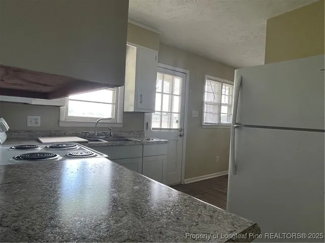 a room with lots of counter and windows