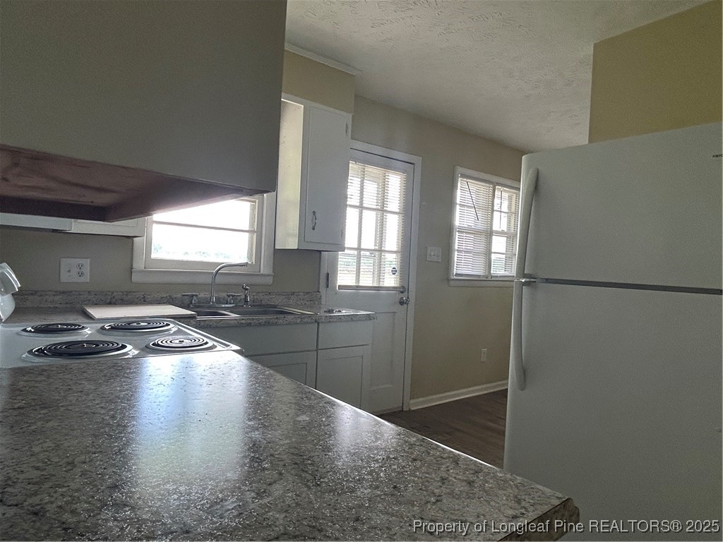 405 Chavis Street, Unit 8 Pembroke, NC 28372 - Photo 6 of 9 a room with lots of counter and windows