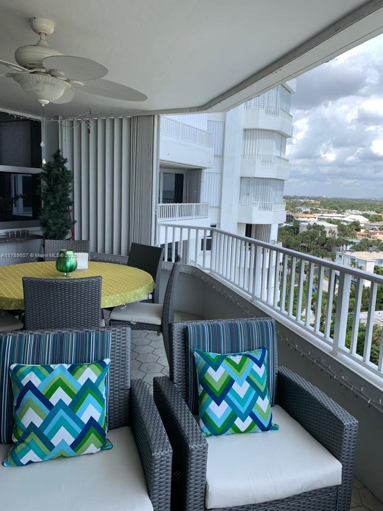 1340 South Ocean Boulevard, Unit 1003 Pompano Beach, FL 33062 - Photo 11 of 27 a living room filled with furniture hardwood and a table
