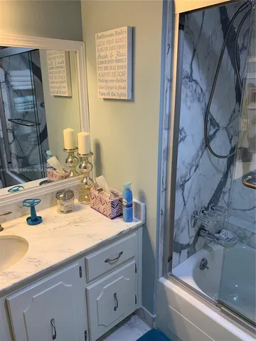 a bedroom with two beds and a window