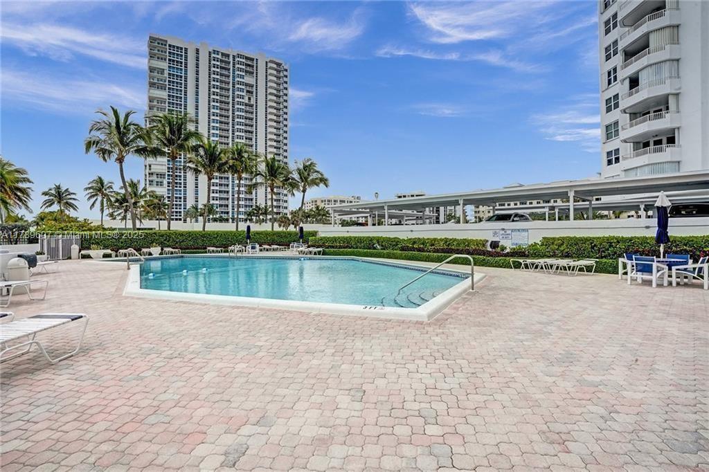 1340 South Ocean Boulevard, Unit 1003 Pompano Beach, FL 33062 - Photo 25 of 27 a view of building with outdoor space and lake view