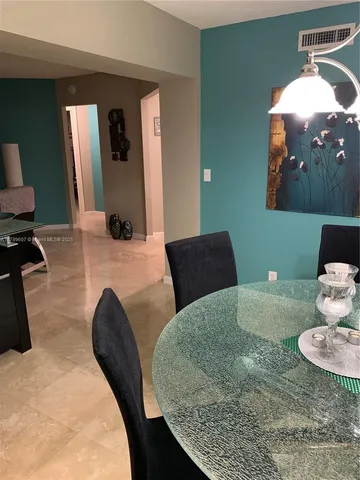 a kitchen with a sink and a mirror