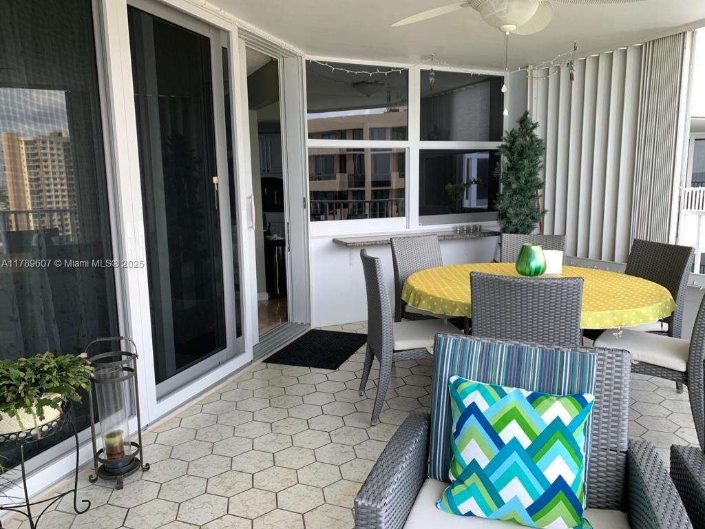 1340 South Ocean Boulevard, Unit 1003 Pompano Beach, FL 33062 - Photo 10 of 27 a living room with furniture and a potted plant