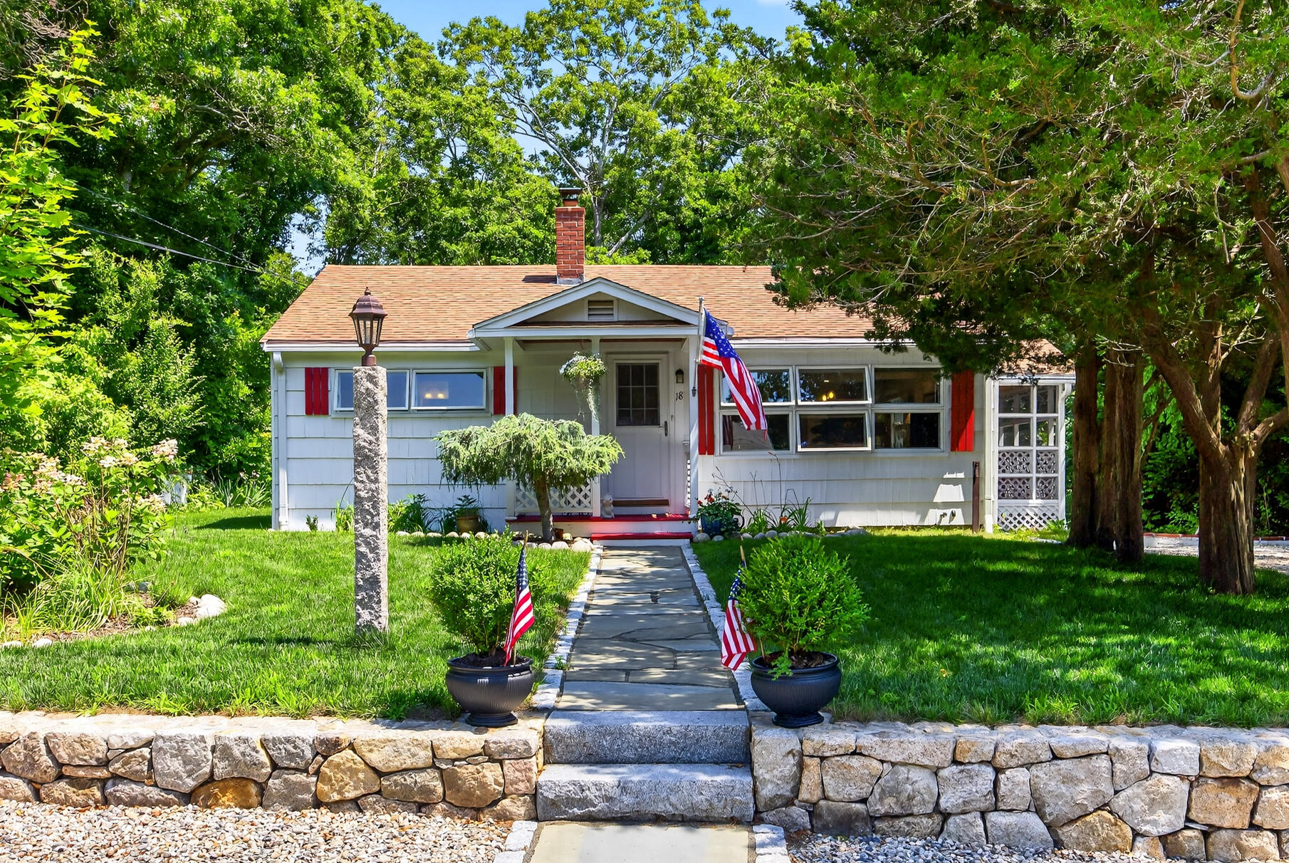 18 Seaview Road Sagamore Beach, MA 02562 - Photo 3 of 62 a front view of a house with a garden