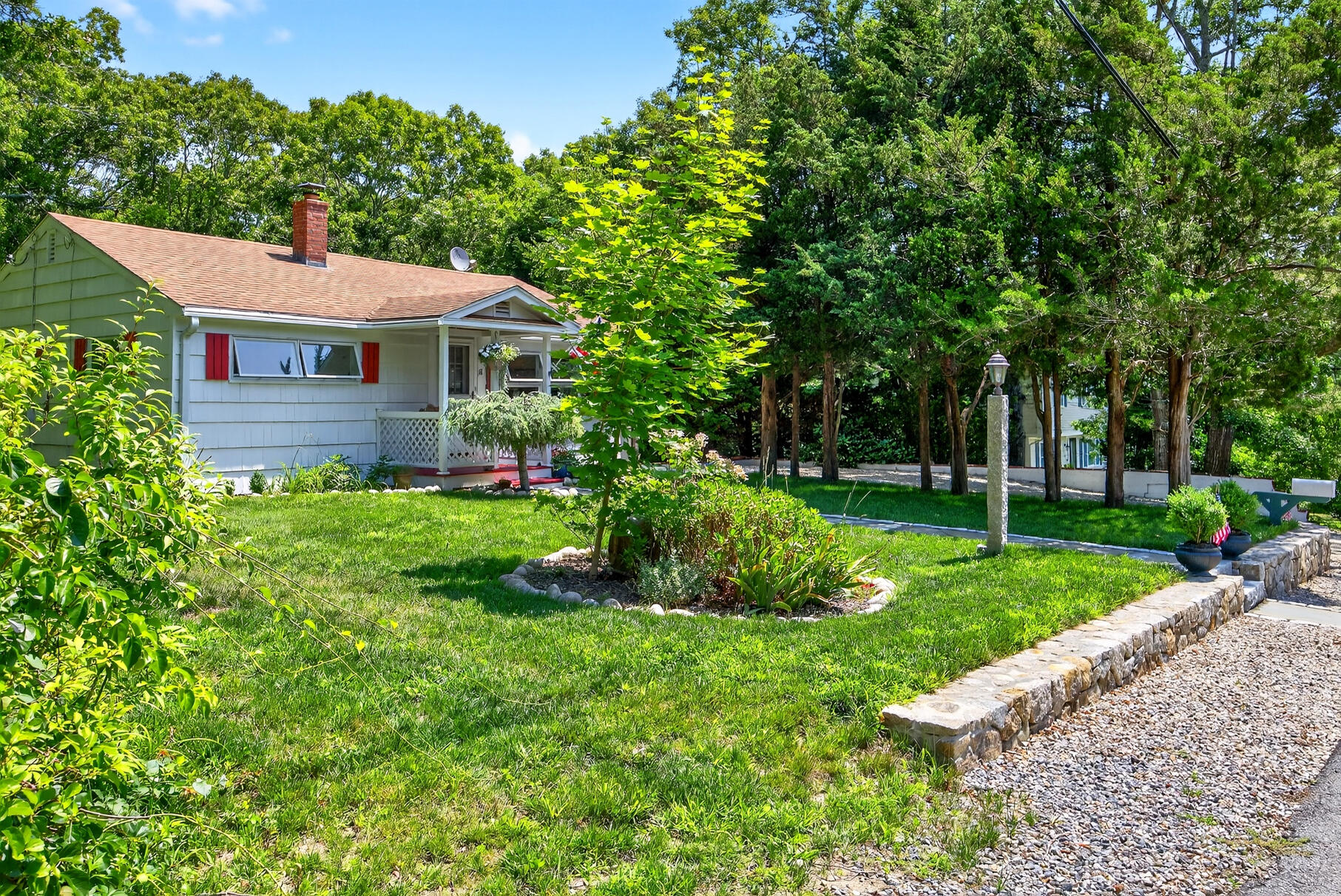 18 Seaview Road Sagamore Beach, MA 02562 - Photo 54 of 62 a front view of a house with garden