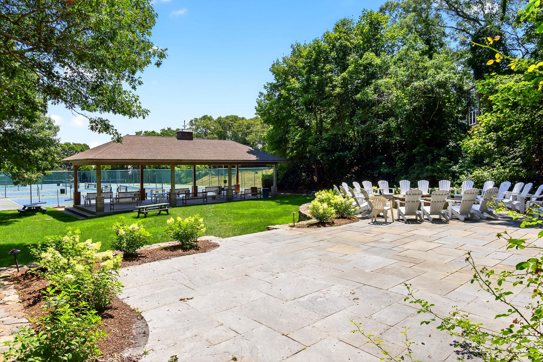 18 Seaview Road Sagamore Beach, MA 02562 - Photo 56 of 62 a view of a house with garden and a sitting area