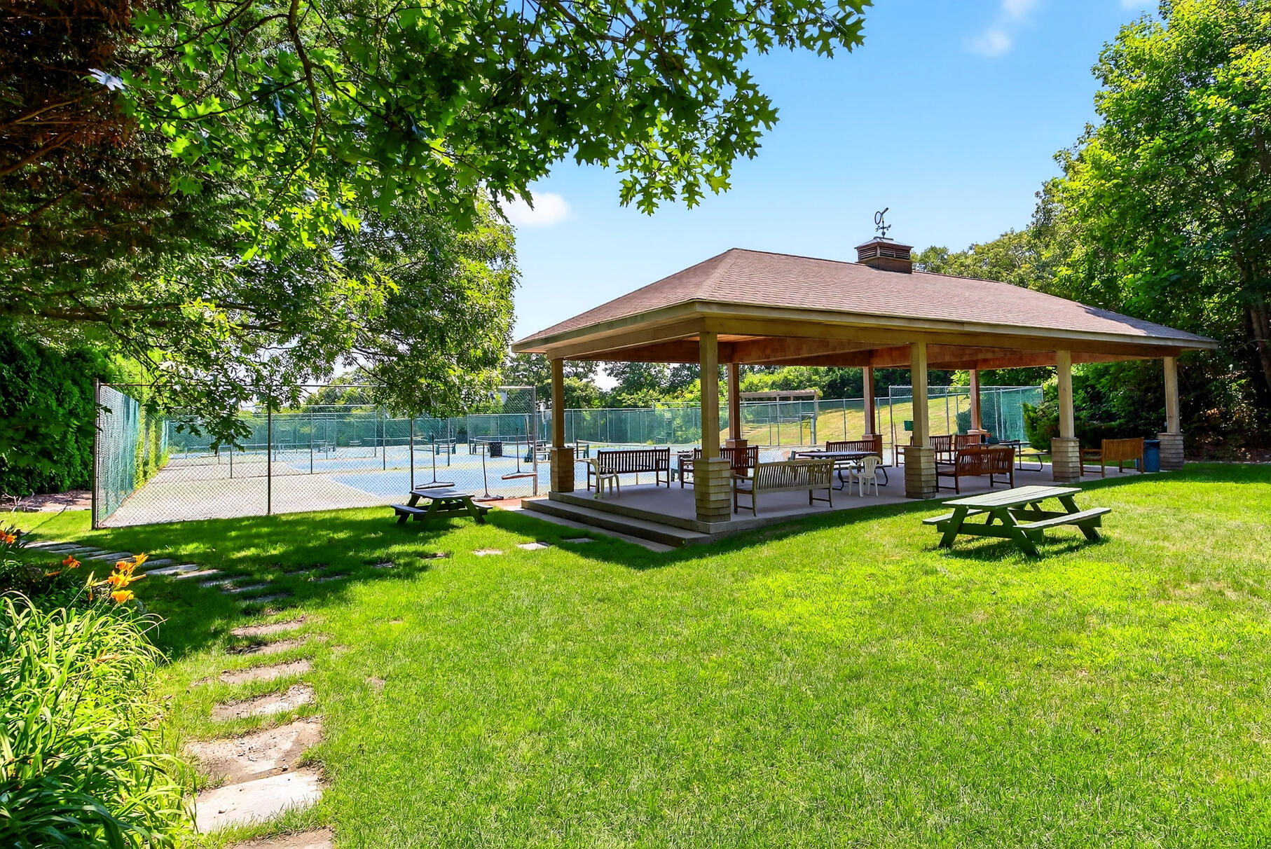 18 Seaview Road Sagamore Beach, MA 02562 - Photo 57 of 62 a view of a table and chairs under an umbrella