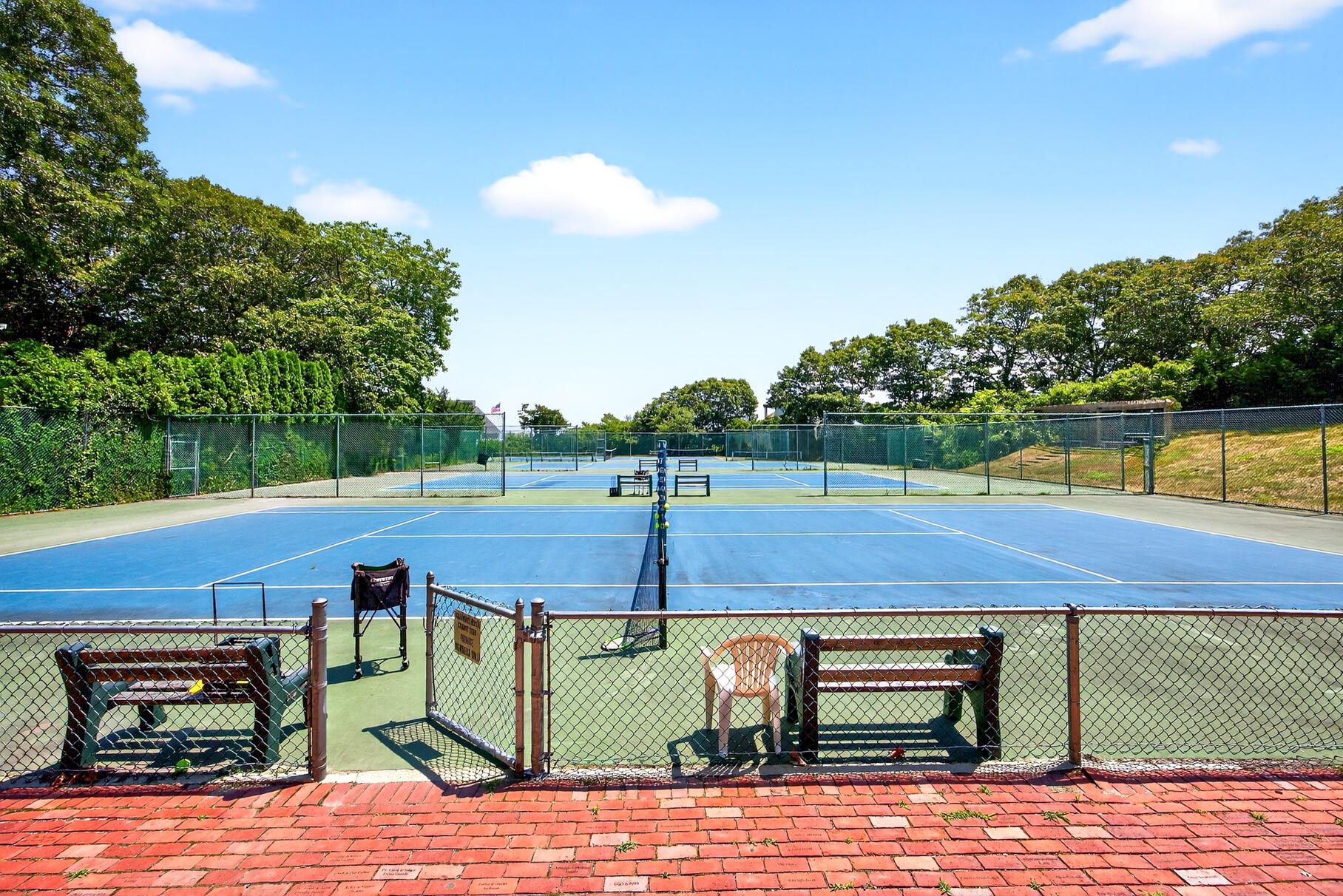 18 Seaview Road Sagamore Beach, MA 02562 - Photo 59 of 62 a view of a tennis court with a table and chairs