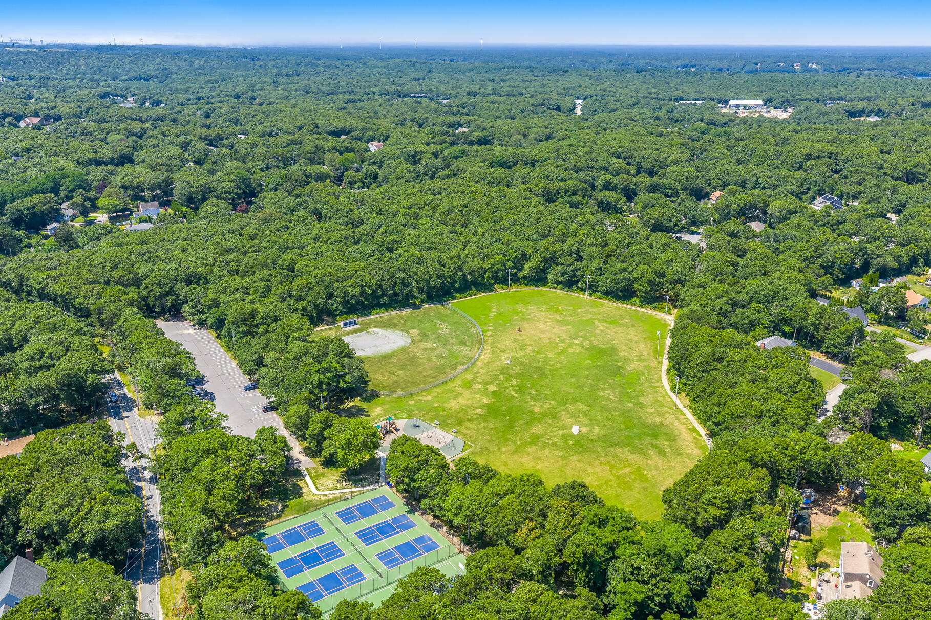 18 Seaview Road Sagamore Beach, MA 02562 - Photo 7 of 62 an aerial view of residential houses with outdoor space and trees