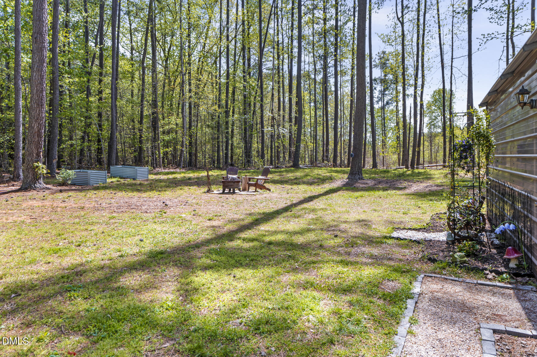 492 Little Mill Road Henderson, NC 27537 - Photo 29 of 39 a view of swimming pool with lawn chairs and plants