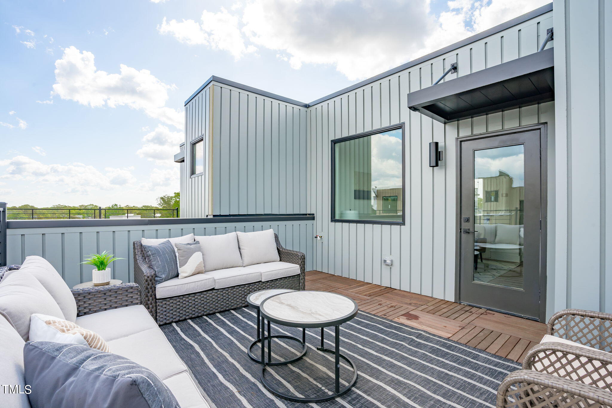 3007 Corbell Durham, NC 27701 - Photo 1 of 36 a balcony with furniture and wooden floor