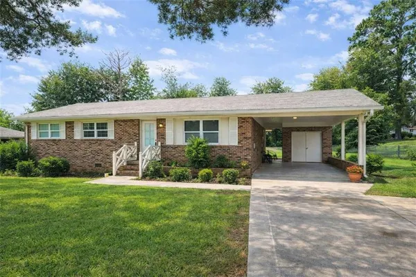 front view of a house with a yard