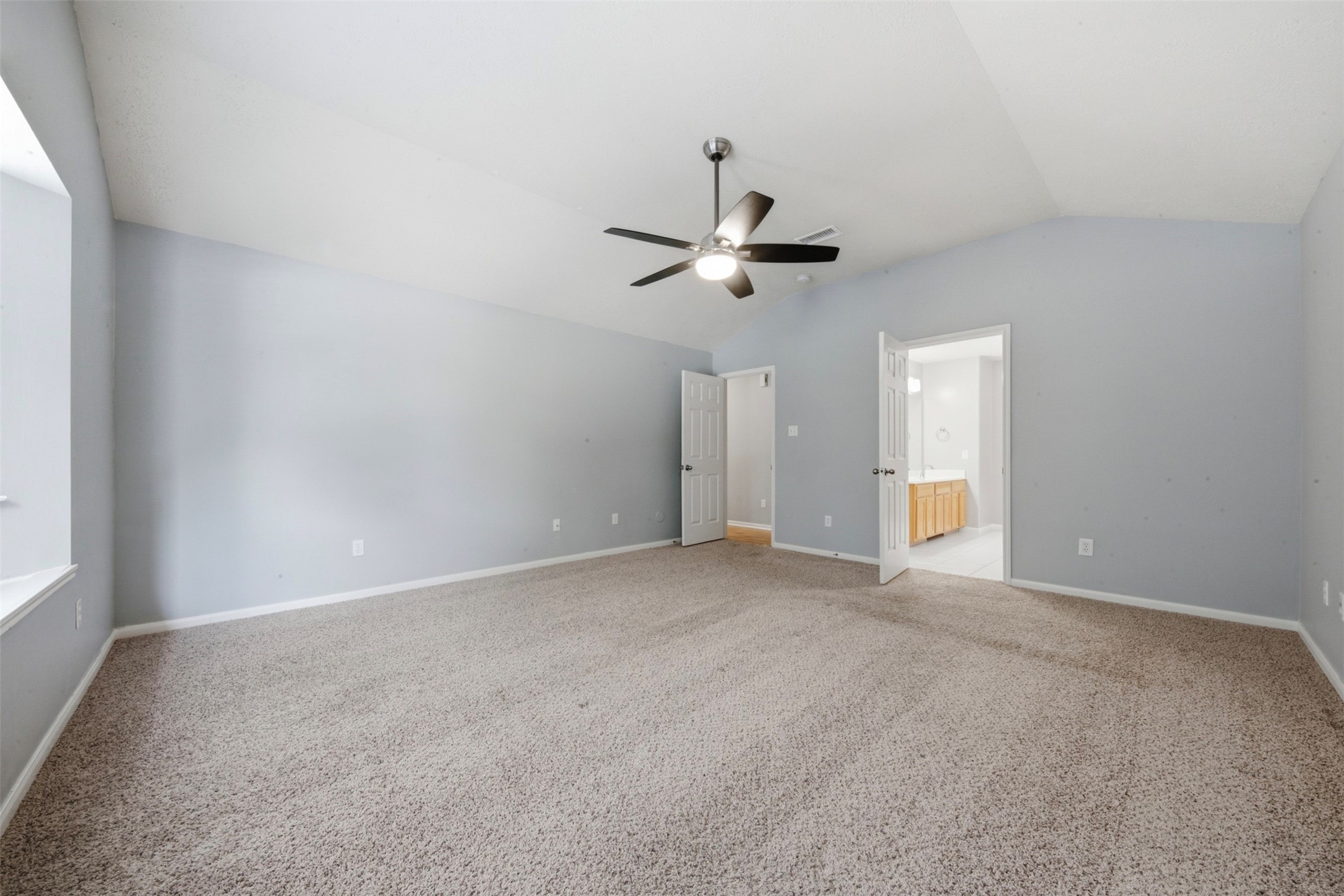 2446 Halstead Drive Spring, TX 77386 - Photo 23 of 45 A large primary bedroom upstairs with updated fan & ensuite bathroom.