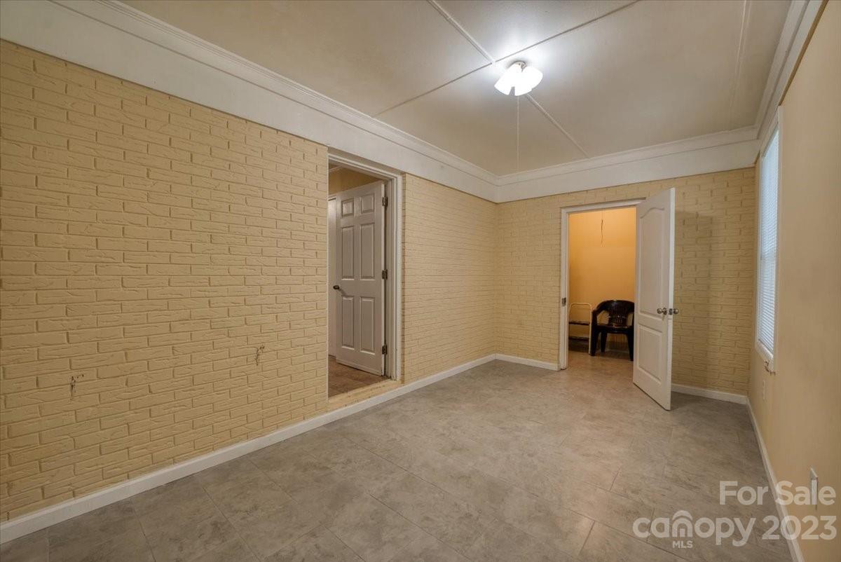 1223 Ranch Road Charlotte, NC 28208 - Photo 28 of 34 a view of an empty room with a window