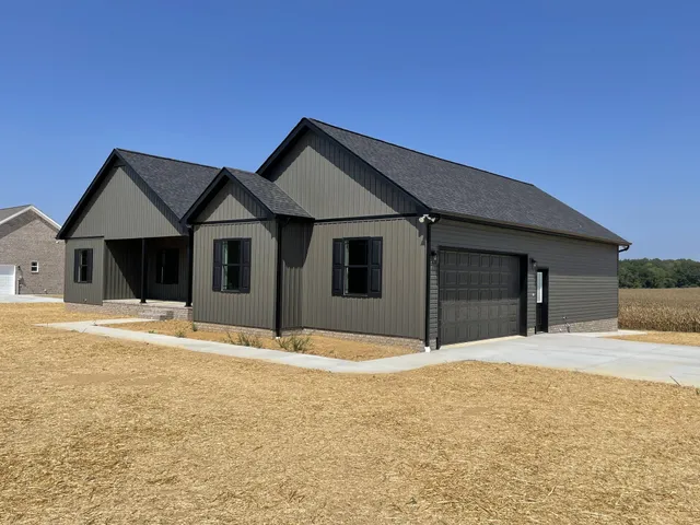 a house with yard in front of it