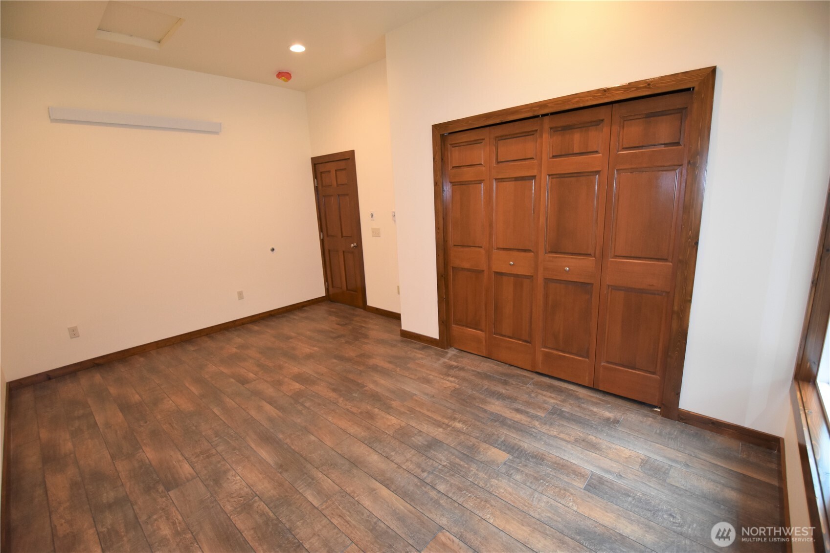 30331 Heimer Road Arlington, WA 98223 - Photo 8 of 37 an empty room with wooden floor