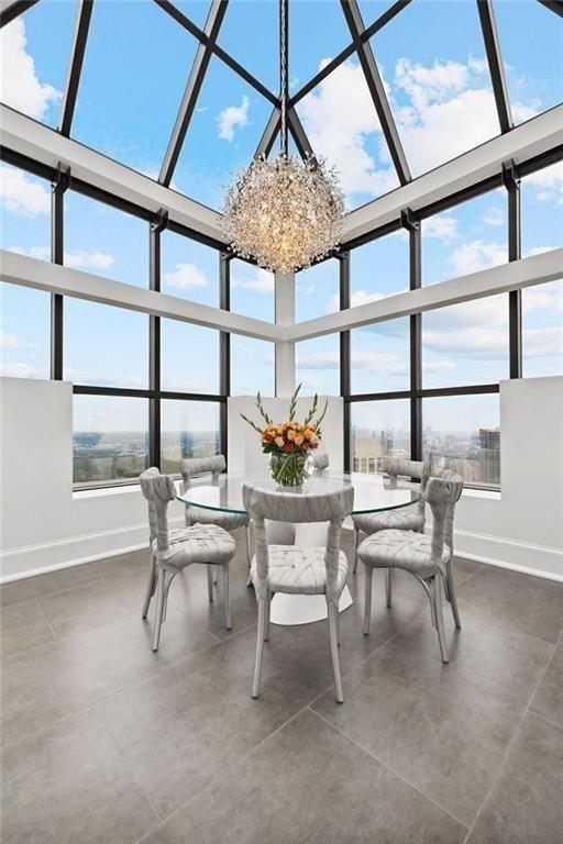2828 Peachtree Road Northwest, Unit P 3300 Atlanta, GA 30305 - Photo 20 of 62 a view of a dining room with furniture window and outside view