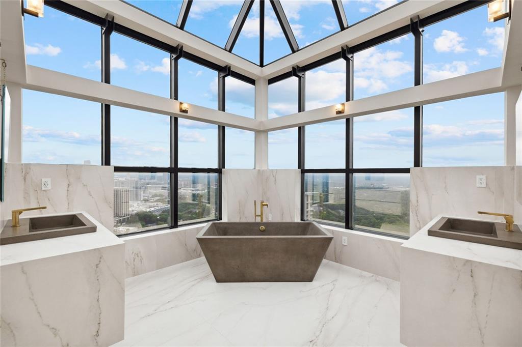 2828 Peachtree Road Northwest, Unit P 3300 Atlanta, GA 30305 - Photo 36 of 62 a large window with a glass top table and chair